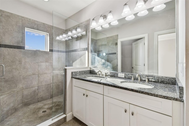 bathroom with vanity and a shower with shower door