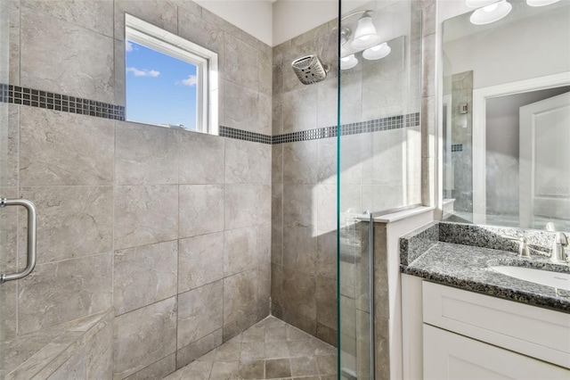 bathroom with vanity and walk in shower