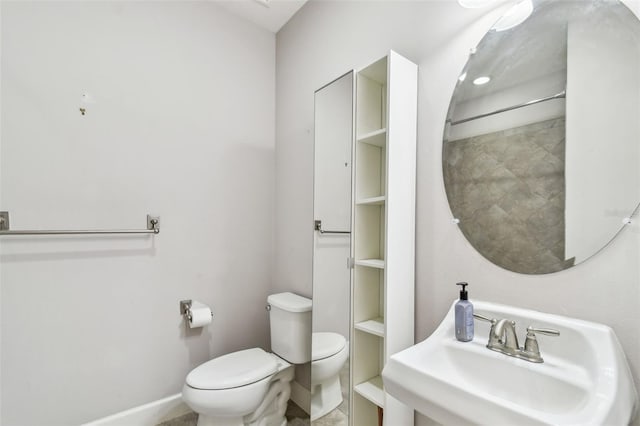 bathroom with sink and toilet