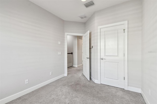 unfurnished bedroom with light carpet