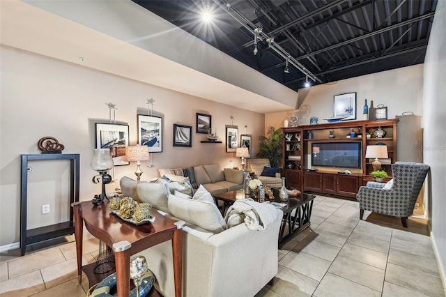 tiled living room with rail lighting