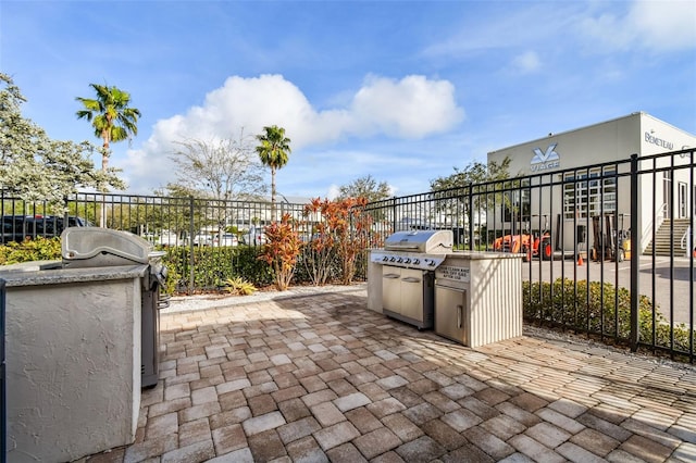 view of patio with area for grilling and exterior kitchen