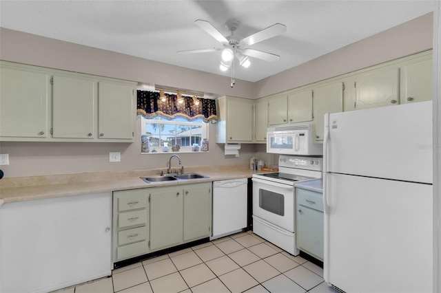 kitchen featuring a ceiling fan, white appliances, light countertops, and a sink