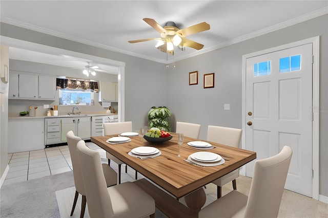 dining area with light tile patterned floors, ornamental molding, and a ceiling fan