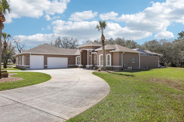 view of front of home with a garage, concrete driveway, a front lawn, and stucco siding