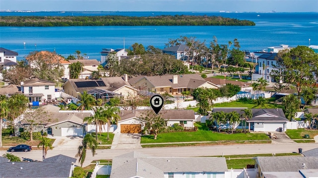 bird's eye view featuring a residential view and a water view