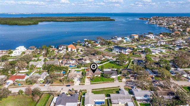 drone / aerial view featuring a residential view and a water view