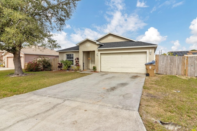 single story home featuring a front yard and a garage