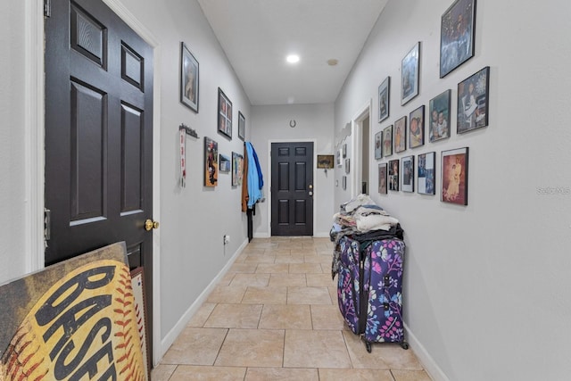 hall featuring light tile patterned flooring