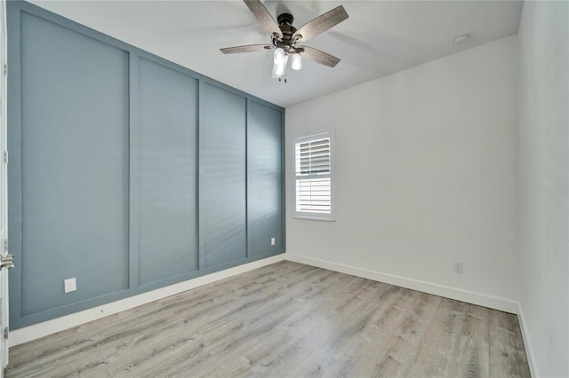 spare room with light hardwood / wood-style floors and ceiling fan