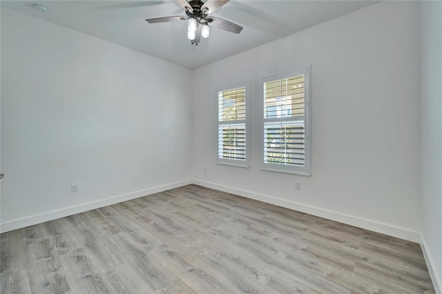 spare room with light hardwood / wood-style flooring and ceiling fan