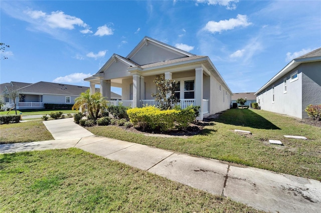 view of front facade with a front yard and a porch