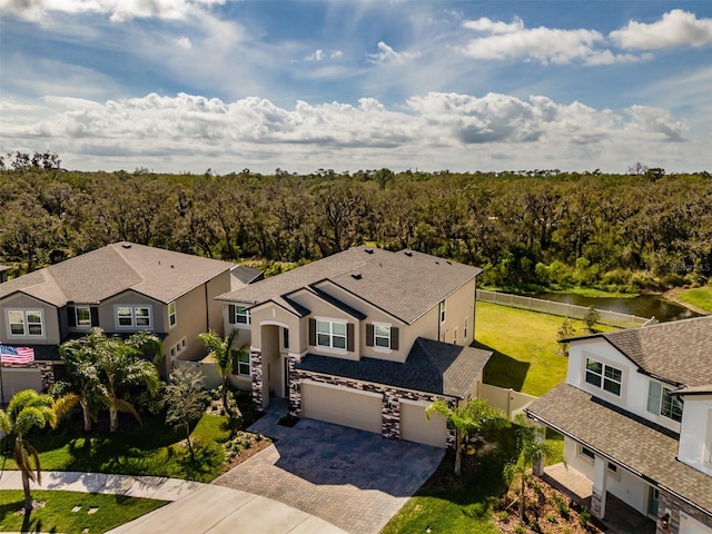 bird's eye view featuring a wooded view