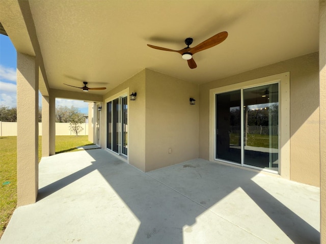 view of patio / terrace featuring fence and a ceiling fan