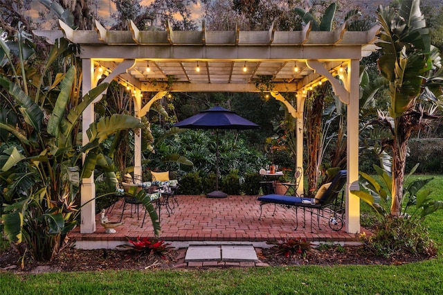 patio terrace at dusk with a pergola