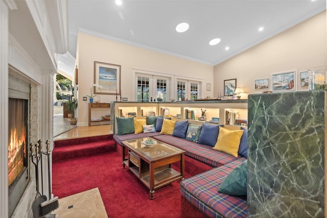 carpeted living area featuring lofted ceiling, ornamental molding, a warm lit fireplace, and recessed lighting