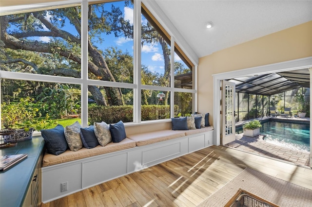 sunroom / solarium with lofted ceiling