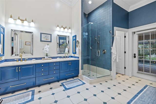 full bathroom with a sink, a shower stall, crown molding, and tile patterned floors