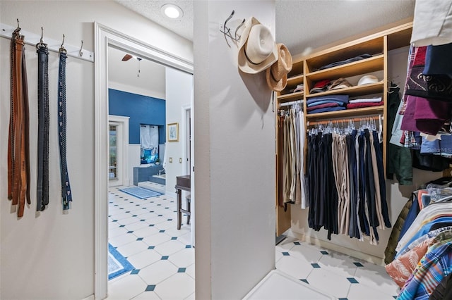 spacious closet with tile patterned floors