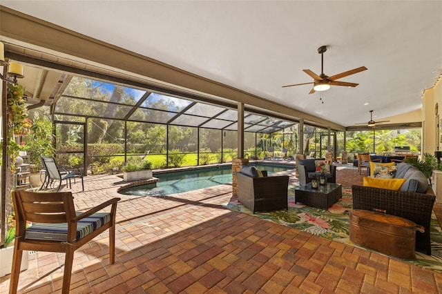 view of patio / terrace with ceiling fan, glass enclosure, an outdoor hangout area, and an outdoor pool