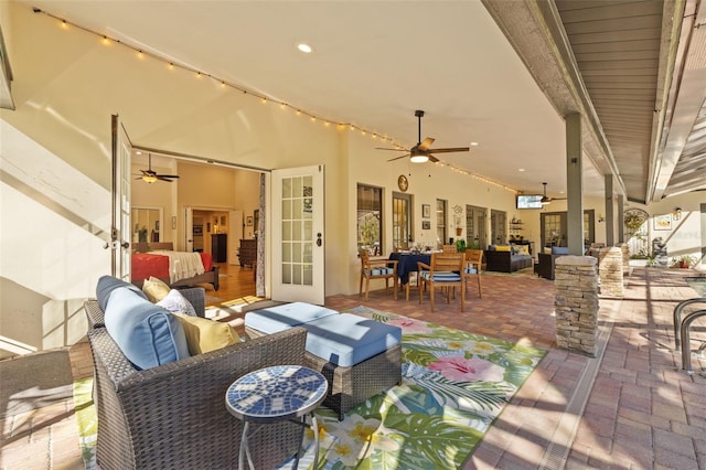 view of patio with ceiling fan and outdoor lounge area