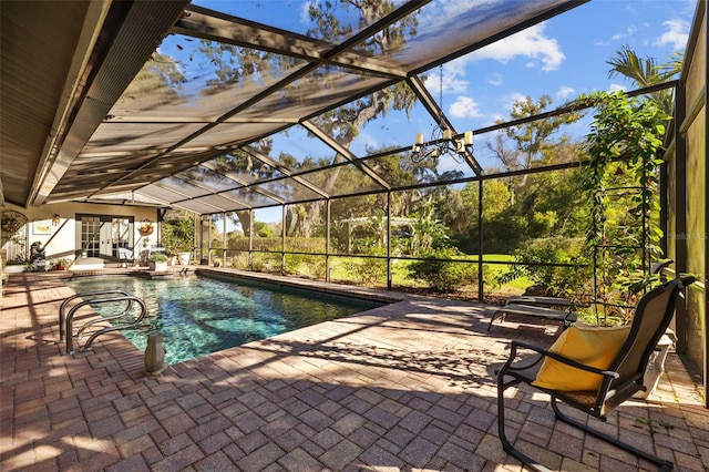 outdoor pool featuring a patio and a lanai