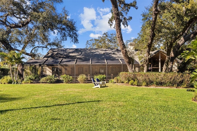 view of yard featuring glass enclosure