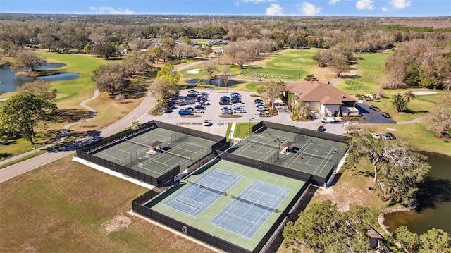 aerial view with a water view and golf course view