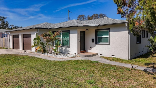 view of front of property with a front lawn and a garage