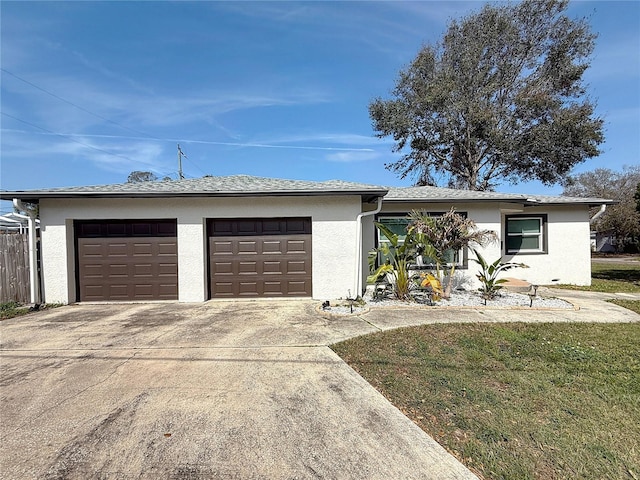 ranch-style home with a garage and a front yard