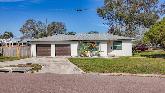 view of front facade featuring a front yard and a garage