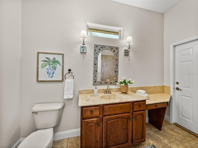 bathroom featuring toilet and vanity