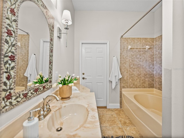 bathroom with vanity and tiled shower / bath