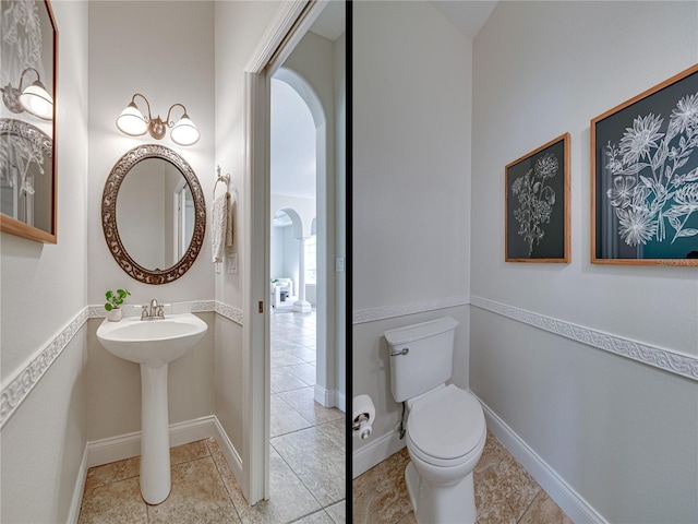 bathroom with tile patterned floors and toilet