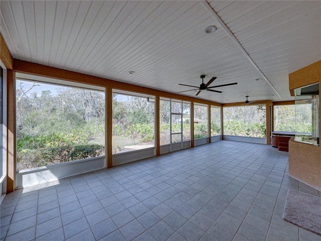 unfurnished sunroom with a wealth of natural light