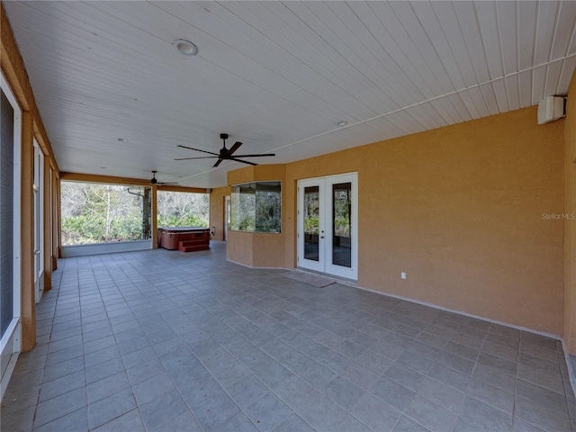 unfurnished sunroom featuring french doors and wood ceiling