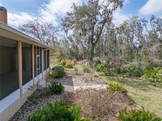 view of yard with a sunroom