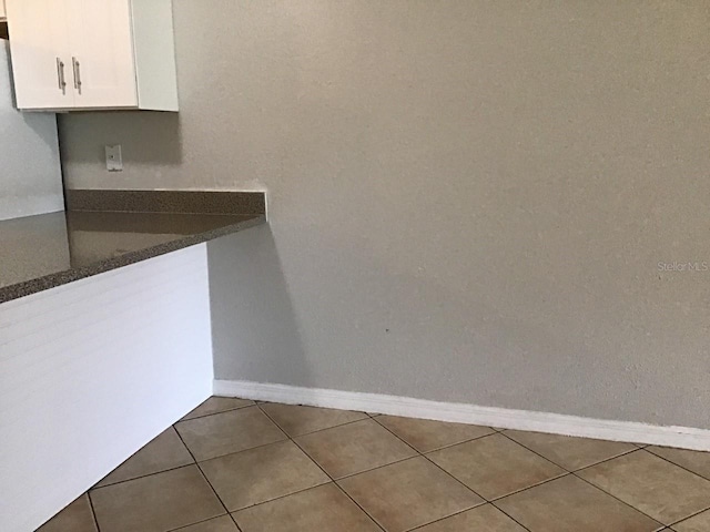 interior space featuring baseboards