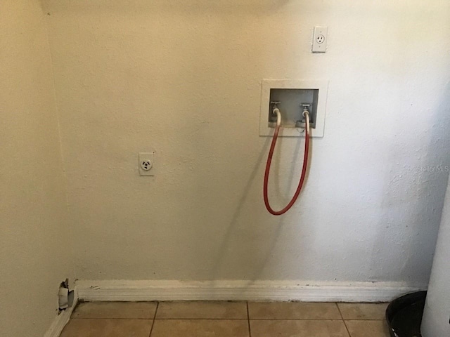 laundry area with washer hookup, laundry area, hookup for an electric dryer, and tile patterned floors