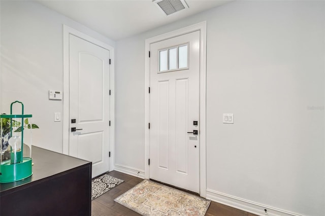 foyer with dark hardwood / wood-style floors