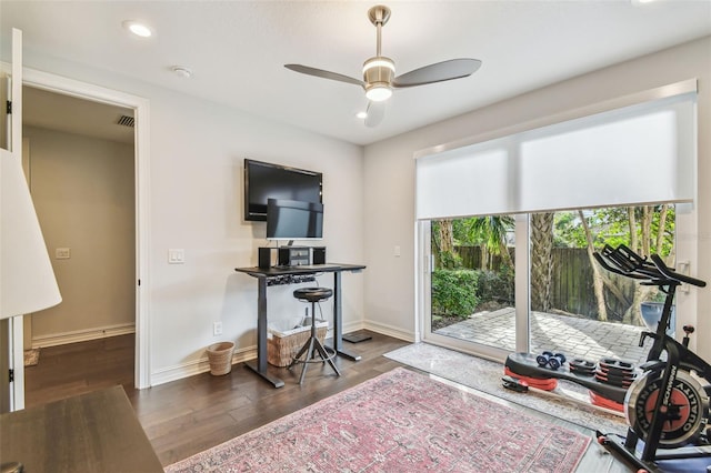 home office featuring dark hardwood / wood-style floors and ceiling fan