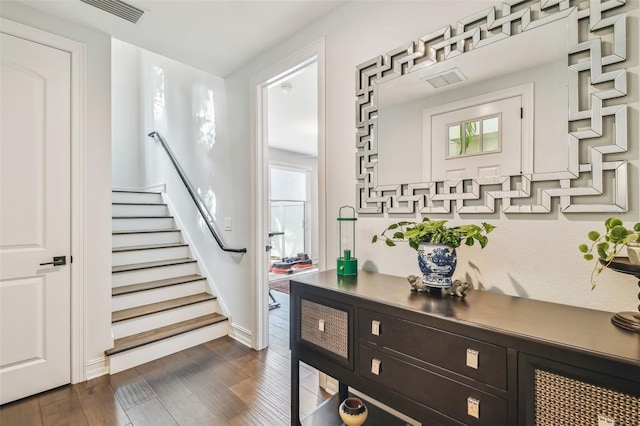 stairs with hardwood / wood-style flooring