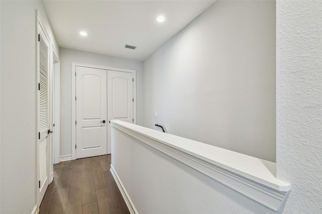 hallway featuring dark wood-type flooring