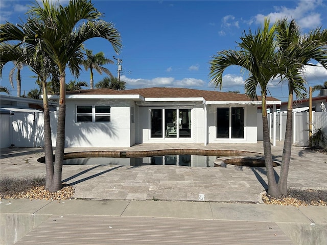 rear view of property featuring a patio