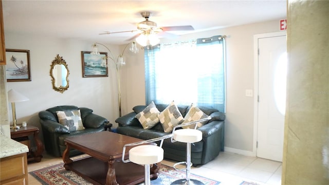 living room with ceiling fan and a wealth of natural light