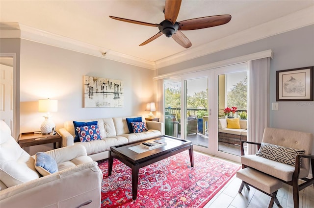 living area with ceiling fan and crown molding