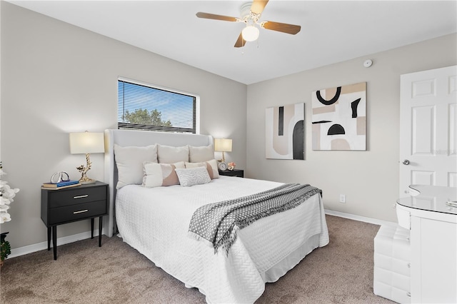 carpeted bedroom with a ceiling fan and baseboards