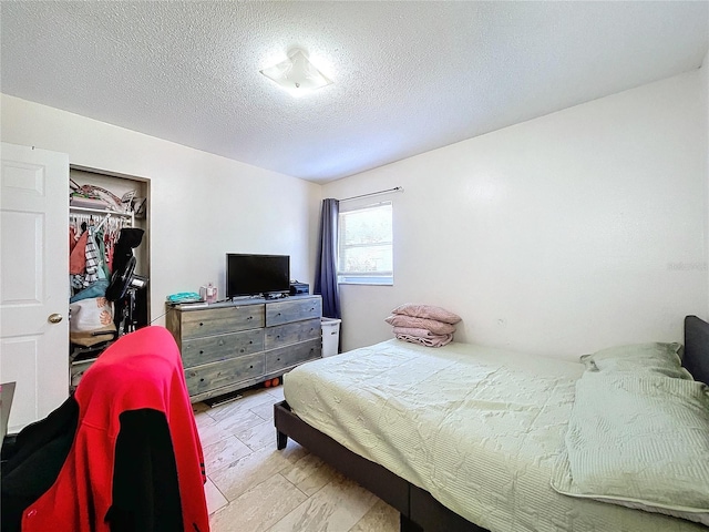 bedroom with a textured ceiling