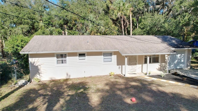 view of front of house featuring a shingled roof