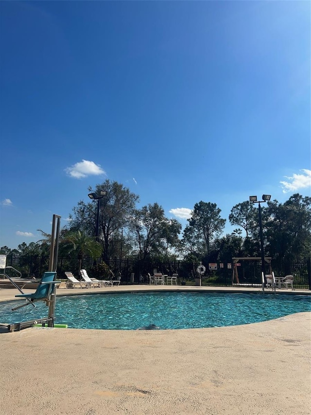 view of swimming pool featuring a patio